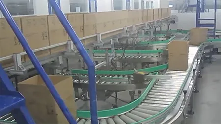 Sistem Conveyor untuk Penanganan Carton